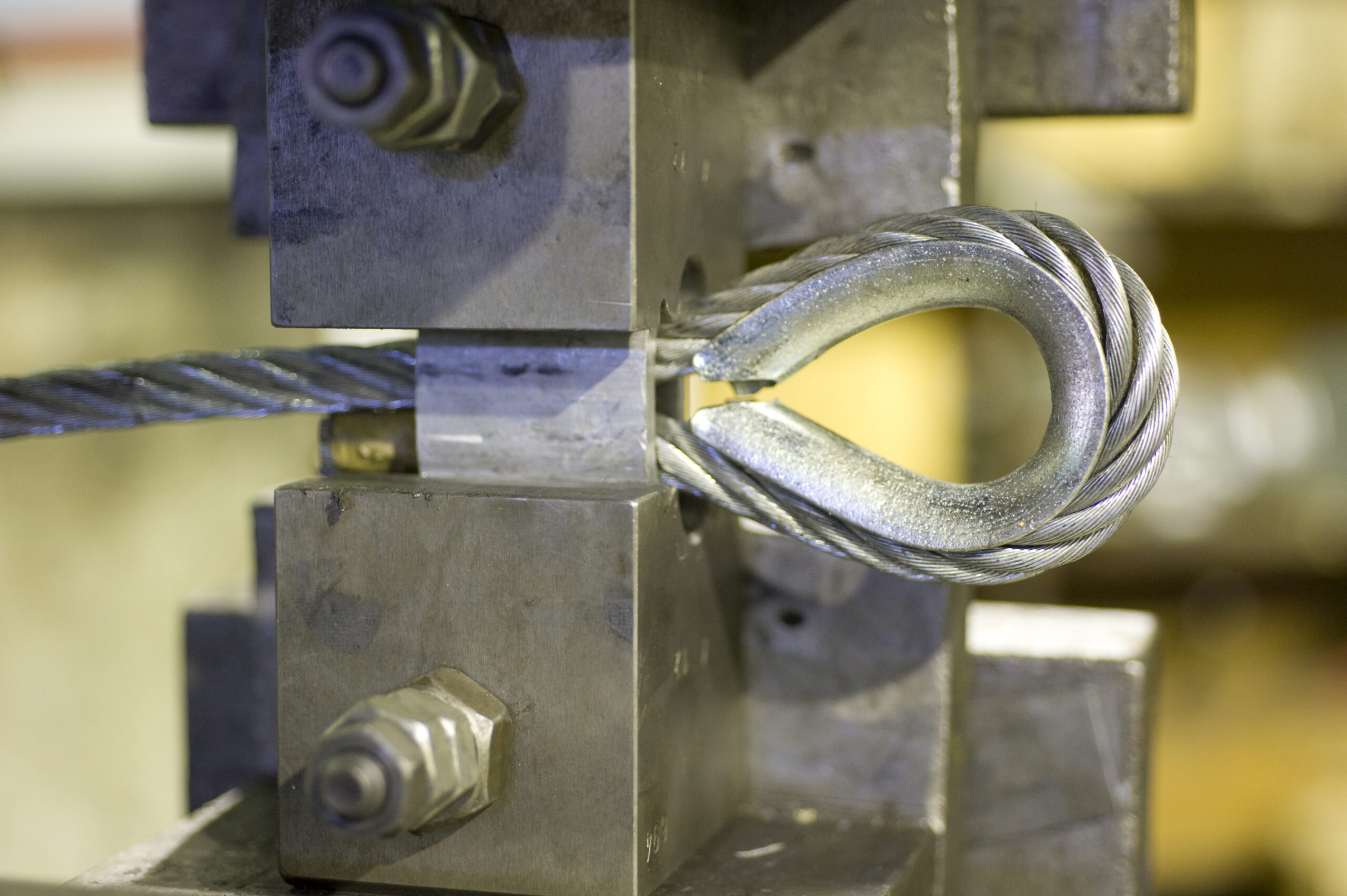 wire rope sling termination using hydraulic press and thimble eye fitting