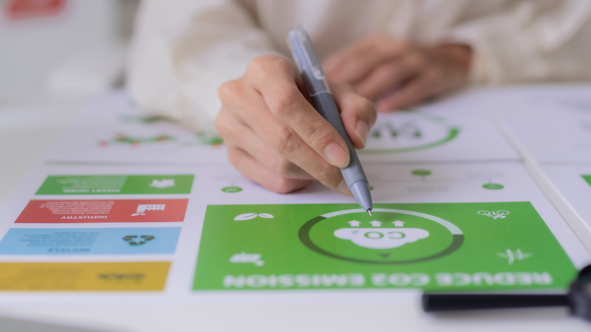 Close-up of a person completing an ESG sustainability assessment chart, representing environmental and social performance evaluation